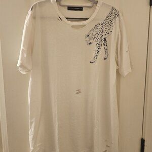Womens loose tee with tears as designed by manufacturer